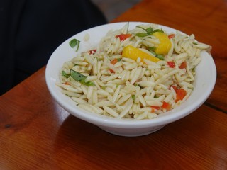 Rice salad in a white bowl served island-style
