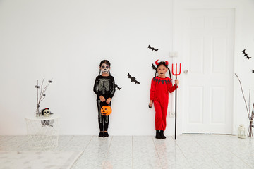 Asian child girls in halloween costumes