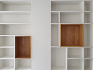 Empty closet shelves background. Modern wooden wardrobe boxes, beautiful white and brown interior...