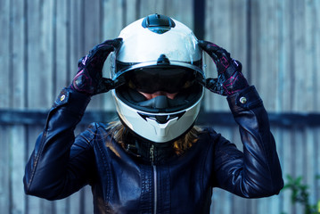 Woman in leather jacket wear motorcycle helmet