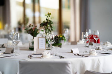 decorated wedding tables with flowers and Menu card
