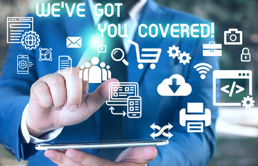 Fototapeta premium Word writing text We Ve Got You Covered. Business photo showcasing have done gotten or provided whatever needed Male human wear formal work suit presenting presentation using smart device