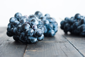 red grape on black wooden table