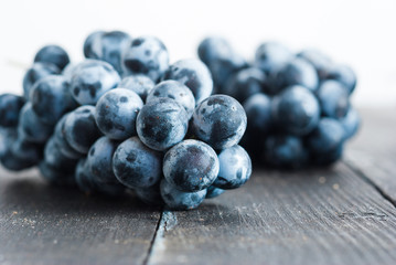 red grape on black wooden table