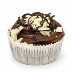 Homemade chocolate cupcake isolated on white background, high angle view