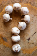 champignon mushroom sharp wooden background 