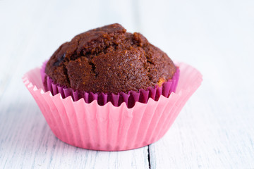 chocolate muffin on white wooden table