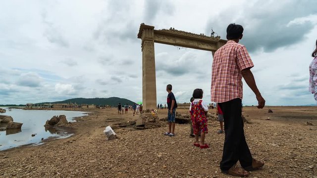 time lapse of people visit the ruins of Nong-Bua temple under the water of Pasak Jolasid Dam after the water reduced in Lopburi, Thailand