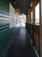 Narrow passage beside a wooden building by a dock