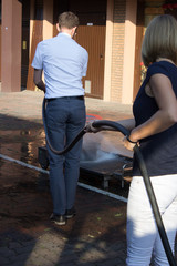Fototapeta premium Teachings. Man extinguishes the fire hose.