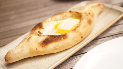 Ajarian traditional flatbread - khachapuri or hachapuri. Georgian food