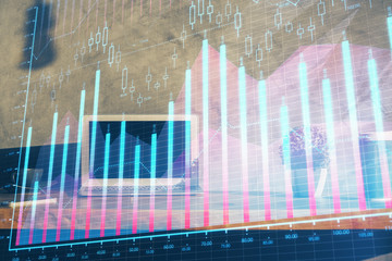 Multi exposure of chart and financial info and work space with computer background. Concept of...