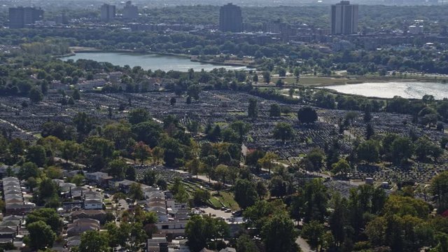 NYC New York Aerial v154 Panning cityscape from Cedar Grove cemetery to Manhattan skyline views with Corona Park and traffic views - October 2017