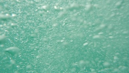 Bubbles rising to the surface. Air bubbles in water in sea (underwater shot), good for backgrounds. Slow motion.
