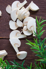 Champignon mushrooms on a dark background