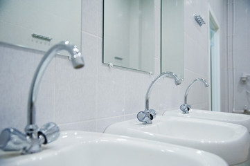 Fototapeta premium Close-up of row modern ceramic wash hand basins