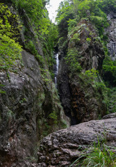 Fototapeta na wymiar Waterfall in the Xuansheng Area of Mount Yandong in Yueqing, Zhejiang, China.