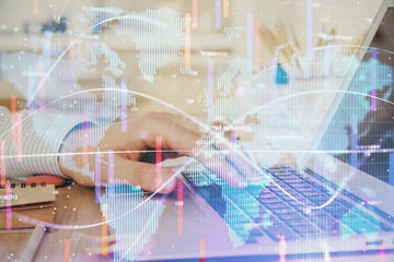 Multi exposure of businessman working on laptop on background. International business hologram in front. Concept of success.