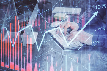 Double exposure of financial graph with man works in office on background. Concept of analysis.