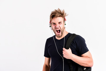 relax playlist. sexy muscular man listen music from playlist. man relax in earphones isolated on...