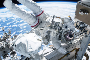 Astronaut in outer space at the space station. Elements of this image were furnished by NASA