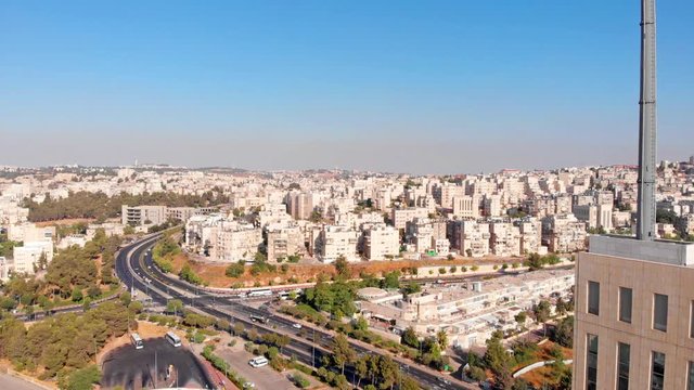 Top building with large antena , Jerusalem Mount Hotzvim Aerial Drone footage over Large building in Hi tech Park Jerusalem Israel