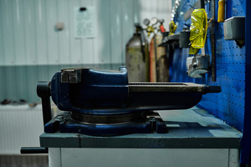 On the desktop, auto mechanic locksmith vise.