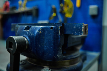 Vise on the desktop auto mechanic in a car service.Close up.