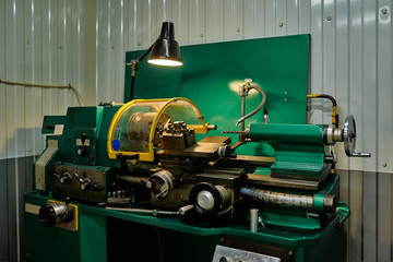 Workplace of a turner. Metal processing technology. Lathe in a car service.