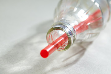 Empty soda bottle and straw