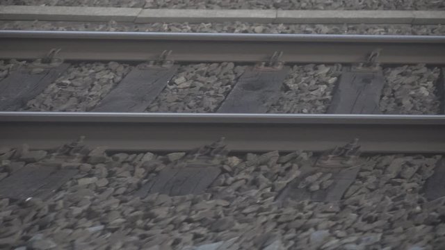 Train rails flashing by and splitting up