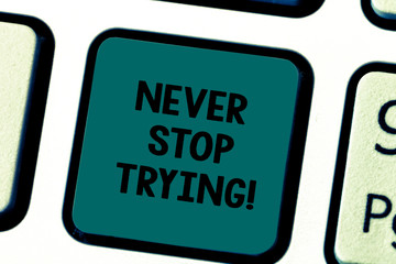 Fototapeta premium Writing note showing Never Stop Trying. Business photo showcasing fight hardest battle inorder reach your goals and dreams Keyboard key Intention to create computer message pressing keypad idea