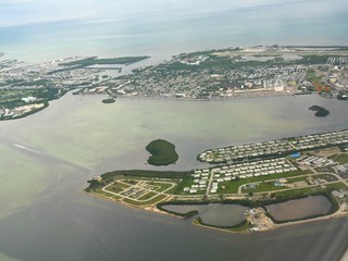 Scenic Key West, aerial view seen from an airplane window. The Key West is the southernmost city in...