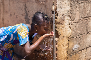 Water for Life and Planet Earth, African Black Girl Drinking
