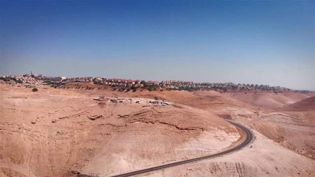 Bedouin Camp Close to Israeli City Maale Adumim Aerial Drone footage over Bedouin outpost Close to Israeli City Maale Adumim Aerial