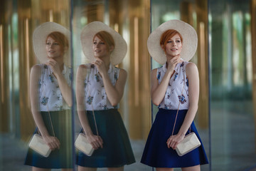 Young attractive cheerful woman walking in city.