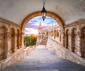 Budapest, Hungary. Ancient Fishermans Bastion castle. View at tower from stairs under arch along...