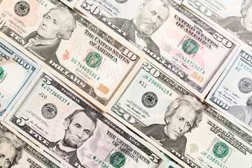 Close up of different dollar bills as a background. Amarican dollars pattern. Top view of business concept