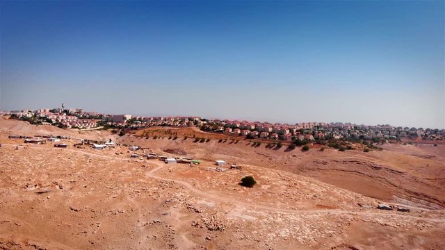 Bedouin Camp Close to Israeli City Maale Adumim Aerial Drone footage over Bedouin outpost Close to Israeli City Maale Adumim Aerial