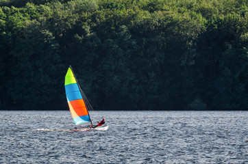 YACHTING - The catamaran floats on the lake in the sunshine