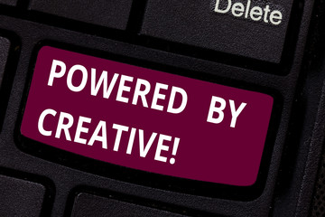 Writing note showing Powered By Creative. Business photo showcasing characterized by originality of thought or inventiveness Keyboard key Intention to create computer message pressing keypad idea