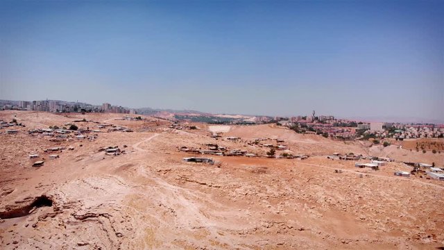 Bedouin Camp Close to Israeli City Maale Adumim Aerial Drone footage over Bedouin outpost Close to Israeli City Maale Adumim Aerial