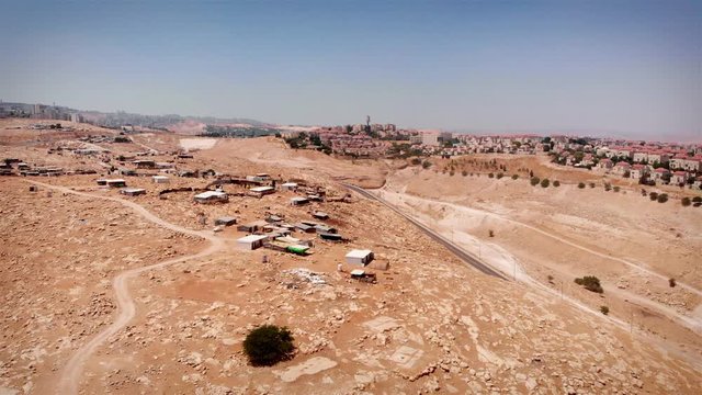 Bedouin Camp Close to Israeli City Maale Adumim Aerial Drone footage over Bedouin outpost Close to Israeli City Maale Adumim Aerial
