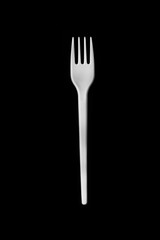 plastic fork for food on a black background