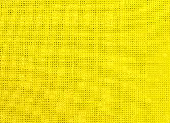 Textured background of yellow natural textile 