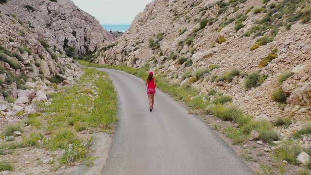 woman running on the road with mountain, trail-marathon