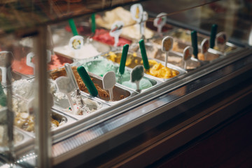 Fototapeta na wymiar Different varieties of ice cream gelato in the store