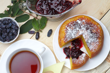 Cottage cheese casserole, fresh honeysuckle and jam, a cup of tea, a simple rustic breakfast.