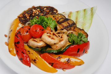 Grilled vegetables on a plate on a gray background