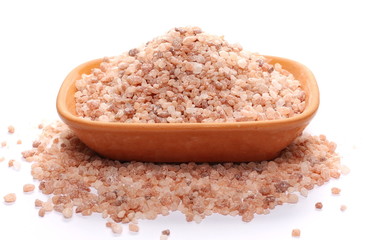 Himalayan salt grains, crystals in clay pot, bowl isolated on white background